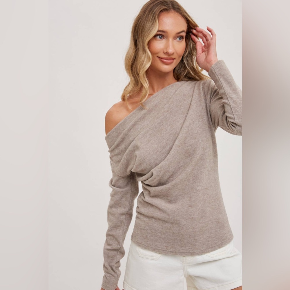Introducing a chic one-shoulder knit top with a pleated front